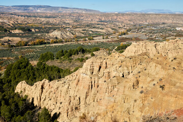 Cárcavas de Marchal (Spain), natural monument of Andalusia: cave houses are dwellings excavated in the foothills of the badlands