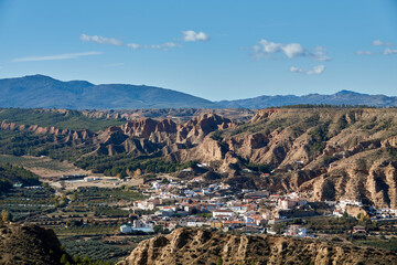Obraz premium Cárcavas de Marchal (Spain), natural monument of Andalusia: cave houses are dwellings excavated in the foothills of the badlands