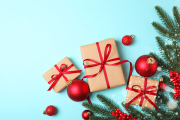 Christmas decorations and gifts on a colored background top view