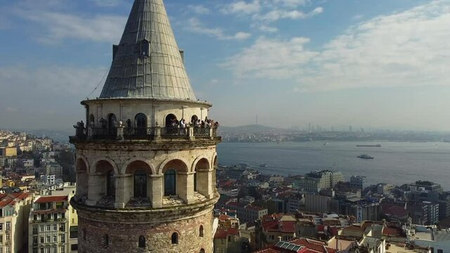 Galata Tower and panoramic view to Golden Horn Bay. Tourists on top of Galata Tower. Istanbul, Turkey. Aerial view.