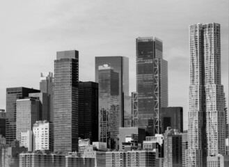 Obraz premium Skyscrapers in the city manhattan new york hotel real estate urban exploration discover walking sign rooms apartment rental leasing architecture building. Black and white. 