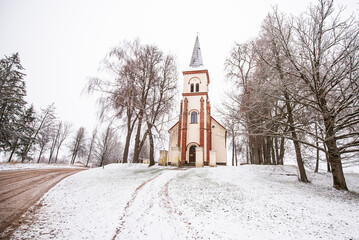 Fototapeta na wymiar Old historical lutheran church in winter day, Valle, Latvia