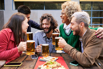 Young friends having fun outdoors - Happy group people enjoying together at Bar terrace - Youth and friendship concept.