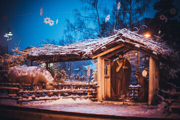 Christmas scene in Bethlehem with Jesus Christ, Joseph, Mary, barn, animals, stars in Ogre, Latvia.