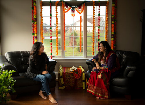 Two women talking at a wedding function 