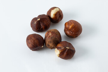 Small portion of roasted hazelnut with skin, on white background