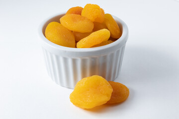 White ceramic pot with delicious dehydrated Turkish apricots