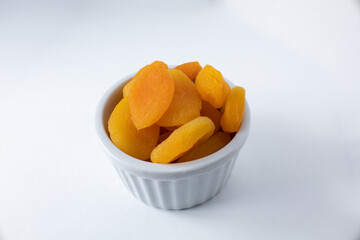 Seedless dried turkish apricots in ceramic ramekin