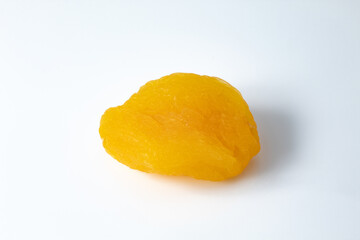 Ripe and dry Turkish apricot fruit, seedless on white background.