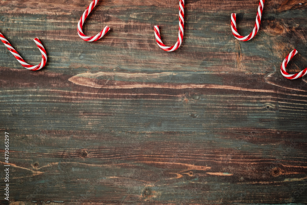 Poster group of candy cane on rustic table top view background
