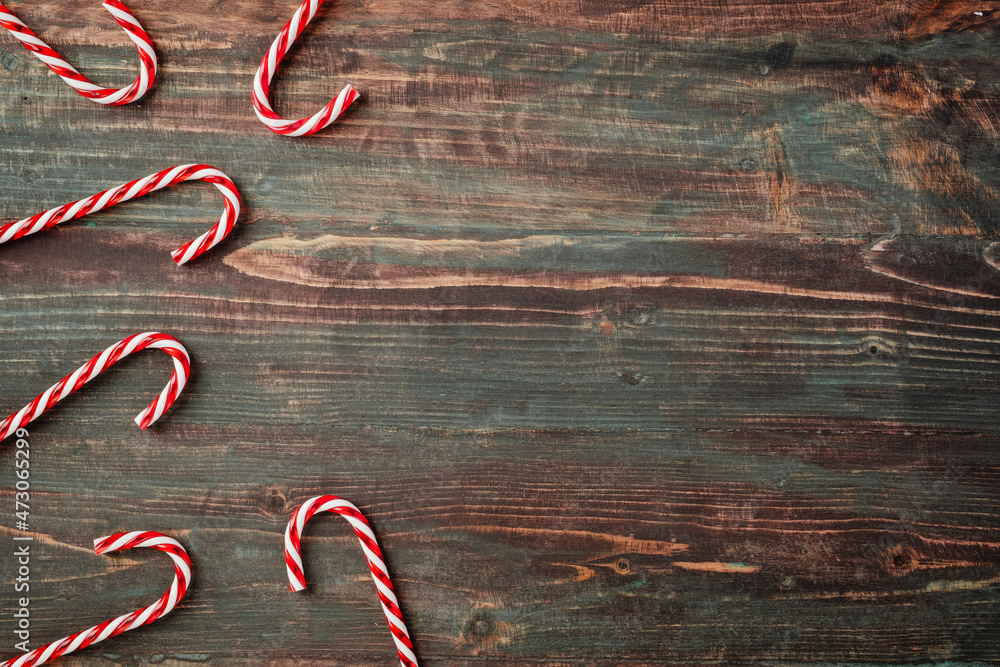 Poster group of candy cane on rustic table top view background