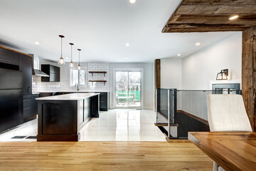 Typical budget Canadian single family house, renovated with some luxury elements in design partially furnished with kitchen, rooms, bedrooms, appliances, finished basement, laundry, backyard and patio