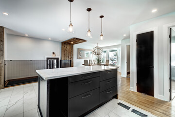 Typical budget Canadian single family house, renovated with some luxury elements in design partially furnished with kitchen, rooms, bedrooms, appliances, finished basement, laundry, backyard and patio