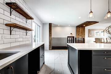 Typical budget Canadian single family house, renovated with some luxury elements in design partially furnished with kitchen, rooms, bedrooms, appliances, finished basement, laundry, backyard and patio