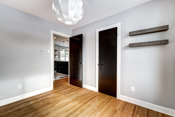 Typical budget Canadian single family house, renovated with some luxury elements in design partially furnished with kitchen, rooms, bedrooms, appliances, finished basement, laundry, backyard and patio