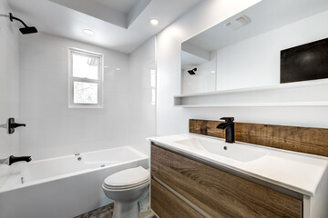 Typical budget Canadian single family house, renovated with some luxury elements in design partially furnished with kitchen, rooms, bedrooms, appliances, finished basement, laundry, backyard and patio