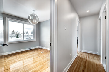 Typical budget Canadian single family house, renovated with some luxury elements in design partially furnished with kitchen, rooms, bedrooms, appliances, finished basement, laundry, backyard and patio