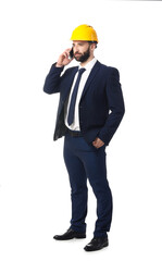 Industrial engineer in hardhat talking by mobile phone on white background