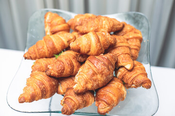 Set of coffee break in the hotel during conference meeting, with tea and coffee catering, decorated catering banquet table with variety of different pastry and bakery, with croissants and cookies