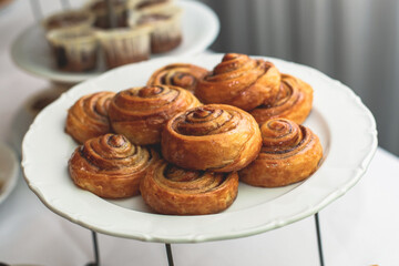 Set of coffee break in the hotel during conference meeting, with tea and coffee catering, decorated catering banquet table with variety of different pastry and bakery, with croissants and cookies