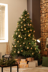 Christmas tree with gifts in room