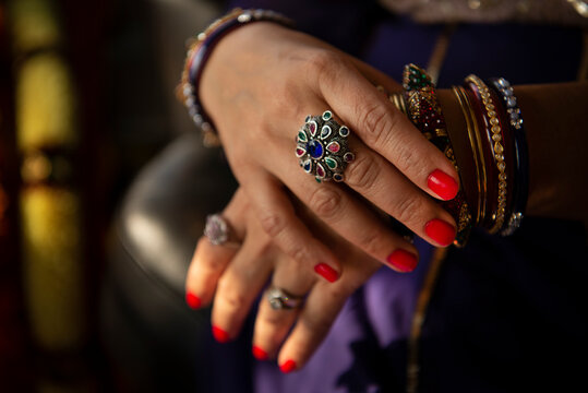Indian woman's hands with bangles and rings 