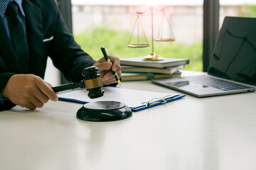Lawyers work with hammers and scales in the office with tiger skins, judges of justice concept.