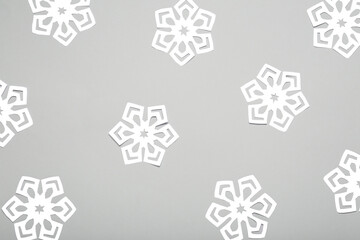 Beautiful paper snowflakes on light background