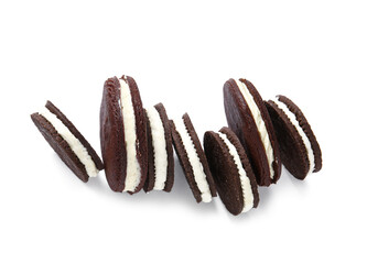 Tasty chocolate cookies with cream on white background