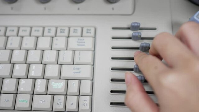 Sonographer adjusting time gain compensation on ultrasound machine