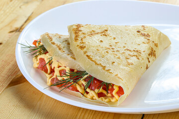 Pancake with salmon fiilet and cheese