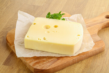 Maasdam cheese over the board