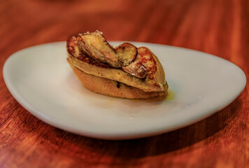 Spanish pintxos with foie gras in a bar in San Sebastian, Basque Country, Spain