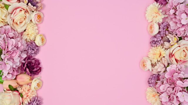 Spring blooming flowers appear on left and right side of pastel pink theme. Stop motion