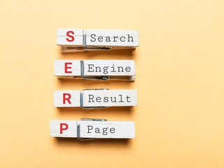Phrase search engine result page on clothes pegs against yellow background.