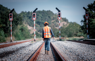 Engineer under inspection and checking construction process railway switch and checking work on...