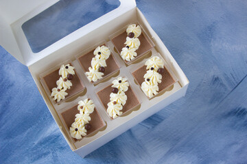 Chocolate panna cotta, dessert trifles in delivery box. Sweet gift, sweet box