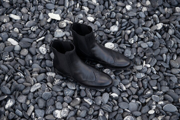 Black boot , Designed black boot, black boot on a stone background, black boot on a special...