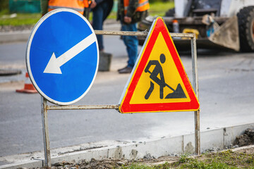 Road signs!Road works with trucks and traffic signs.road works road blocked signs and traffic cones diversion access only;Barriers and road signs.