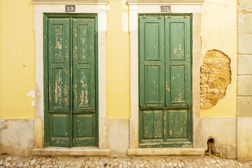 old green door in the old town of Loulé, Algarve, Portugal