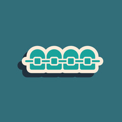 Green Teeth with braces icon isolated on green background. Alignment of bite of teeth, dental row with with braces. Dental concept. Long shadow style. Vector