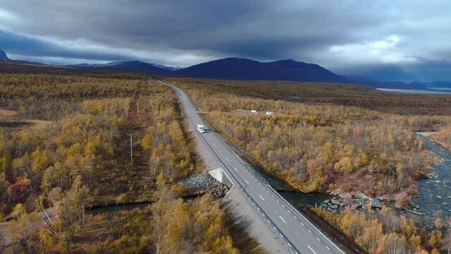 50fps drone footgage Car Camping Caravan driving road lake Swedish Lapland Sunny fall colors Abisko National Park Sweden