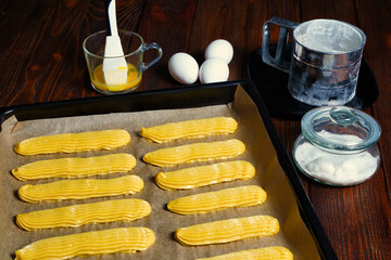 We make eclairs. Cooking Eclair Cakes. The batch was transferred to a baking sheet.