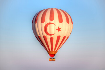 Hot air balloon flying over the valley at Cappadocia, Turkey