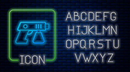 Glowing neon Paint spray gun icon isolated on brick wall background. Neon light alphabet. Vector