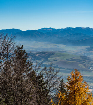 Vah river valley and highest parf of Nizke Tatry mountains from Predny Choc hill in Chocske vrchy mountains in Slovakia