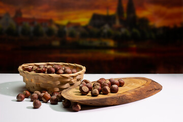 hazelnuts in a basket on a white background