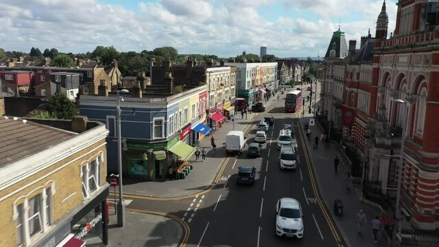 street lined with town houses. Life in urban neighbourhood. Sunny day in Leyton. London, UK