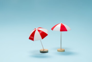 Red umbrella on a blue background.