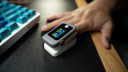 Pulse Oximeter portable digital device to measure person's oxygen saturation. Reduction in...